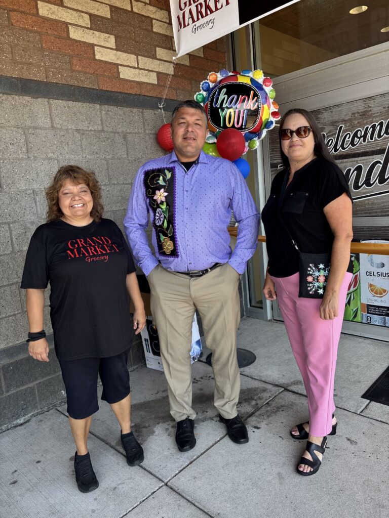 Chief Executive Wind with Wewinabi CEO Michele Palomaki and District I Representative Carolyn Beaulieu.